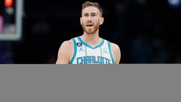 Hornets guard Gordon Hayward raises his arms to question a call